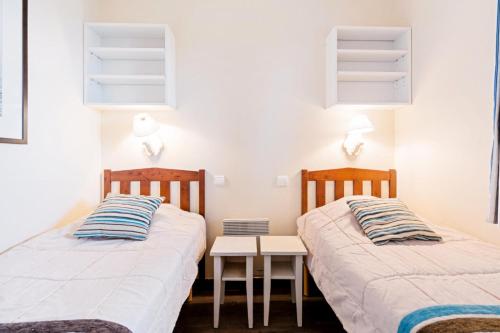 מיטה או מיטות בחדר ב-La Résidence du Golf - maeva Home - Appartement 2 pièces 4 personnes - Conf 38
