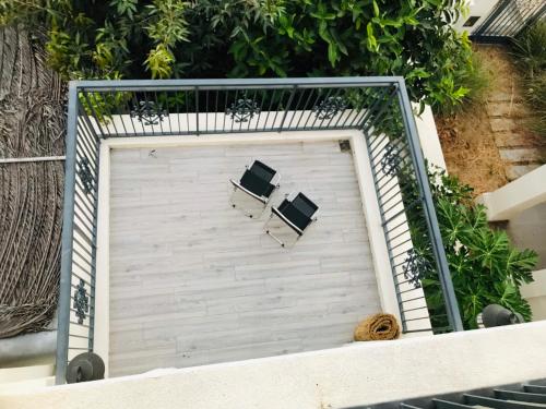 two chairs sitting on top of a garage door at Thong Dong Homestay in Phước Lý