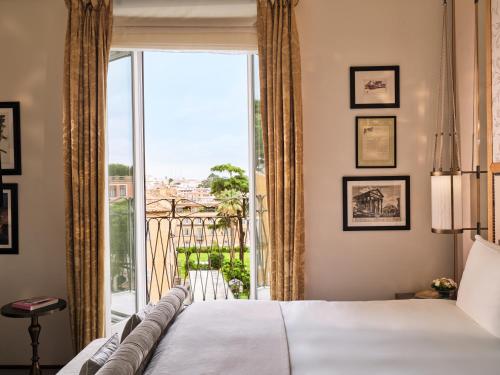 Ένα ή περισσότερα κρεβάτια σε δωμάτιο στο Hotel Eden - Dorchester Collection
