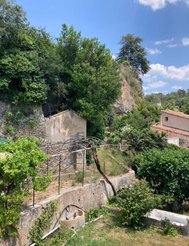 a set of stairs in a hill with trees at Le Couvent des Ecrevisses in Barjols