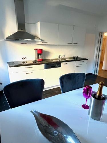 a kitchen with a table with a whale head on it at Alex in Pfaffenhausen