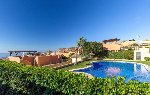 a large swimming pool in front of a house at Gorgeous Home In Cartagena With Wifi in Cartagena