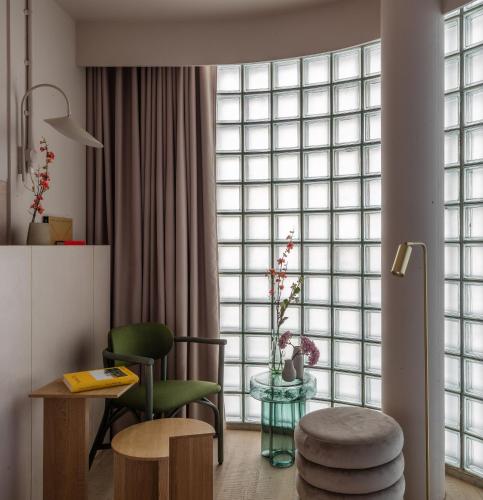 a living room with a large window at Buckle Street Studios by Locke, Aldgate in London