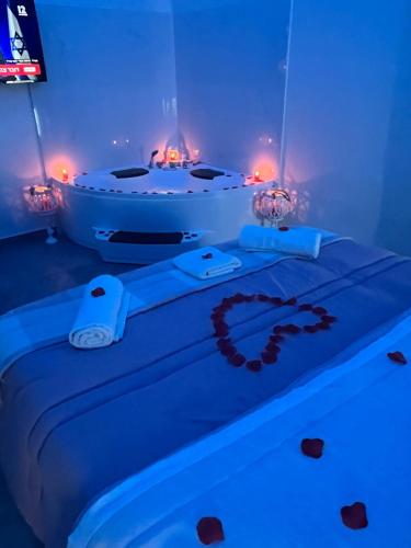 a bathroom with a bath tub with blue lights at House Napoli Capodichino in Naples