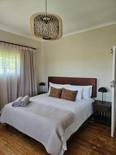 Ένα ή περισσότερα κρεβάτια σε δωμάτιο στο Eikendal Lodge