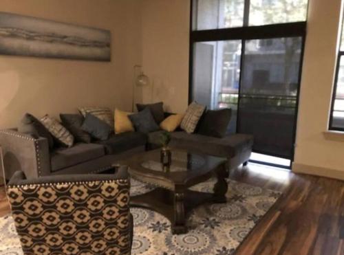 a living room with a couch and a coffee table at 2Bd/2Bth Hermann Park @ Med Ctr in Houston