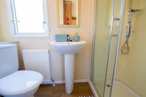 a bathroom with a sink and a shower and a toilet at VAL233 - 4B - Coghurst Park in Westfield