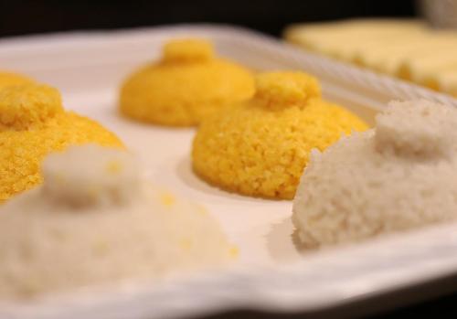 a white plate with yellow food on it at HOTEL CAROLINE in Timon