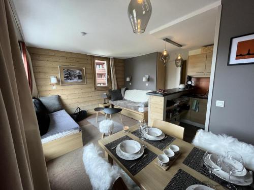 a small living room with a couch and a table at Résidence Plagne Lauze - maeva Home - Appartement super cosy 2 pièces 5 pe 244 in Mâcot La Plagne