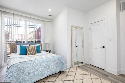 a bedroom with a large bed and a window at Amazing Capital Hill APT , Step away Gym, shopping in Washington, D.C.