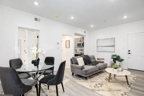 a living room with a table and a couch at Amazing Capital Hill APT , Step away Gym, shopping in Washington, D.C.