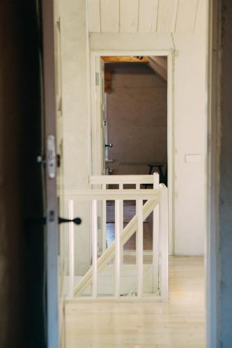 an open door to a room with a gate at Kalnciema kvartāla Kuldīgas rezidence in Kuldīga