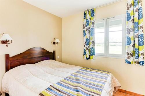 Ένα ή περισσότερα κρεβάτια σε δωμάτιο στο Résidence Les Belles Rives - maeva Home - Appartement 2 Pièces 5 Personnes 284