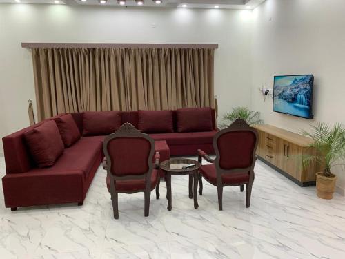 Un lugar para sentarse en Holiday Home Family & Groups