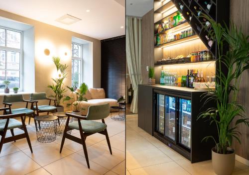 a living room with a fireplace and a restaurant at City Hotels Algirdas in Vilnius
