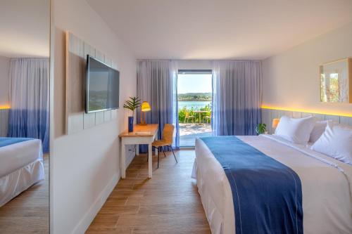 Postel nebo postele na pokoji v ubytování Hotel Aretê