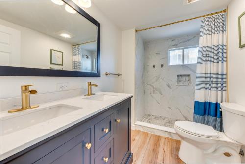 a bathroom with a sink and a toilet and a shower at Beautiful Wells Cottage Steps to Moody Beach! in Wells