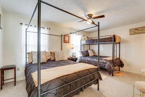 a bedroom with two beds and a ceiling fan at Georgia Townhome - 3 Mi to Stone Mountain Park! in Stone Mountain