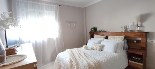 Postel nebo postele na pokoji v ubytování Apartamento Brenes