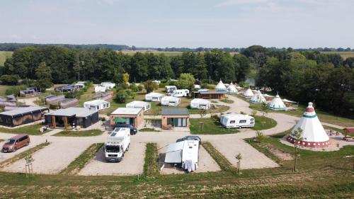 an aerial view of a group of tents and rvs at Tipi Sioux in Belau