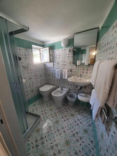 a bathroom with a toilet and a sink at Casa della Frutta in Anacapri