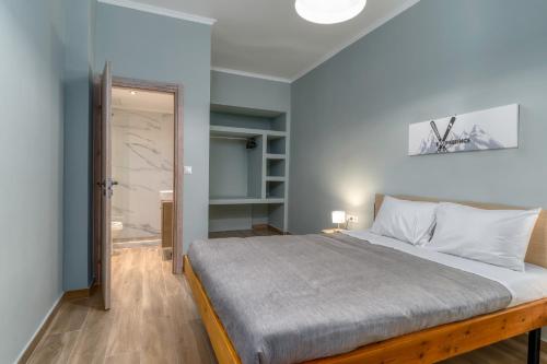 a bedroom with a large bed in a room at Arachova's Experience S2 in Arachova