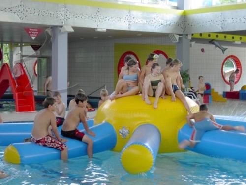 a group of children sitting on top of an inflatable at Apartment Haus Maria Waldblick in Burtenbach