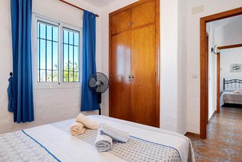 Ένα ή περισσότερα κρεβάτια σε δωμάτιο στο Las Calas de Roche