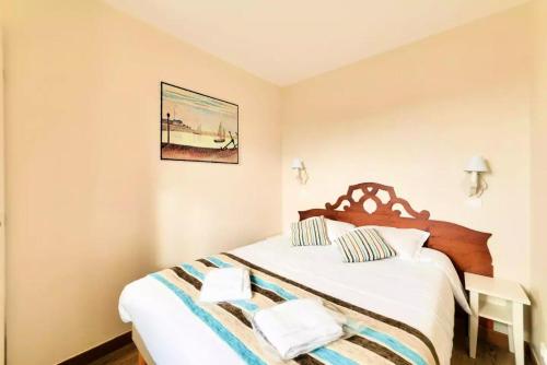 מיטה או מיטות בחדר ב-La Résidence du Golf - maeva Home - Appartement 2 Pièces 7 Personnes - Pre 654