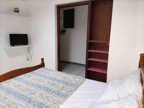 A bed or beds in a room at Appartement d'une chambre avec terrasse et wifi a La Riviere Saint Louis a 9 km de la plage
