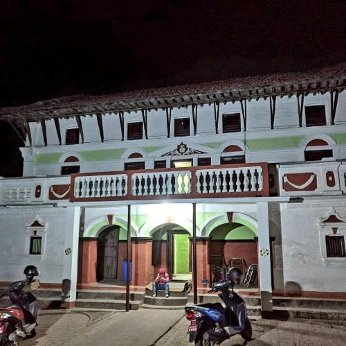 two motorcycles parked in front of a building at Durbar Restro Hotel & Party Venue in Pātan