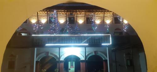 a building with blue christmas lights on it at Durbar Restro Hotel & Party Venue in Pātan