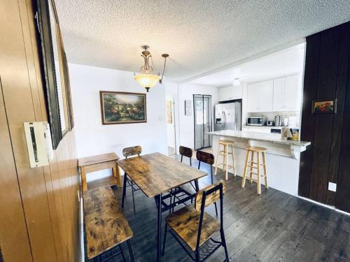 a kitchen and dining room with a table and chairs at 202 Spacious Hayward Entire 4BR SFH in Hayward
