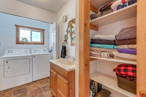 a laundry room with a washer and dryer at Montello Cabin on Buffalo Lake with Dock and Fire Pit! in Montello