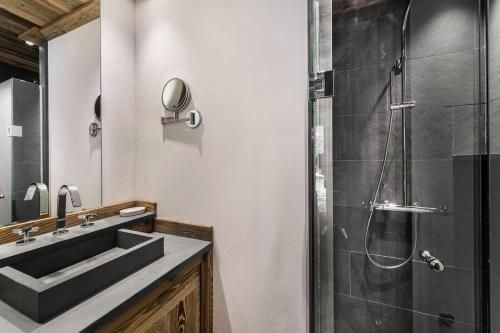 a bathroom with a sink and a shower at Residence La Canadienne - 5 Pièces pour 8 Personnes 624 in Val-d'Isère