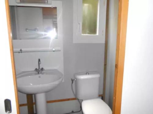 a white bathroom with a sink and a toilet at Chalet 4 étoiles - Parc aquatique - eee0ie in Salles