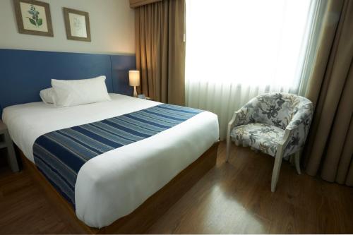 Cama o camas de una habitación en Hotel Saint Simon