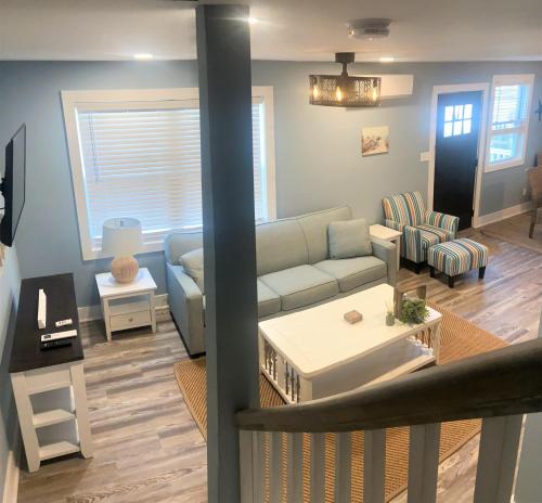 a living room with a couch and a table at Two level, 2-Bedrm, 1 ½ Bathrm. in Seaside Heights