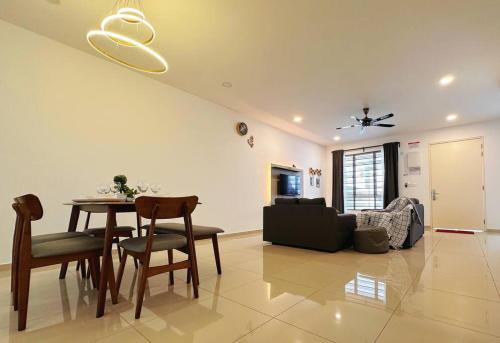 a living room with a table and a couch at 12pax（free wifi）@星愿@Star WISH homestay in Labu