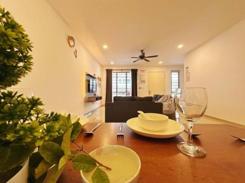 a living room with a wooden table and a dining room at 12pax（free wifi）@星愿@Star WISH homestay in Labu
