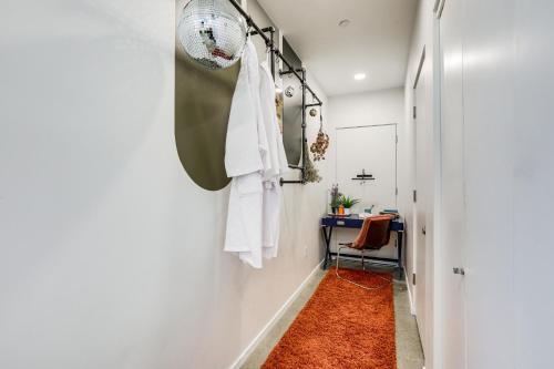 a hallway with a fan and a red rug at Pet-Friendly Sacramento Studio Rental in Sacramento