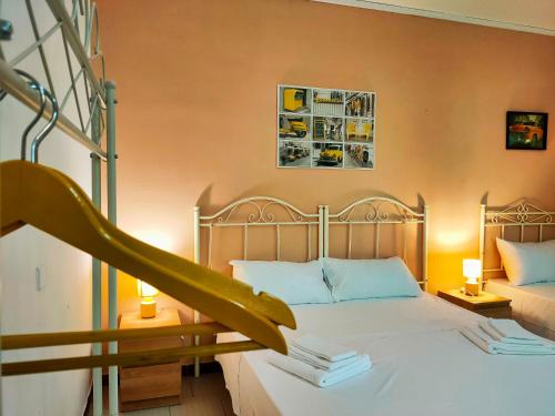 a bedroom with a bed with a staircase in it at Residence Mariposa - Apartments & Rooms in Salve