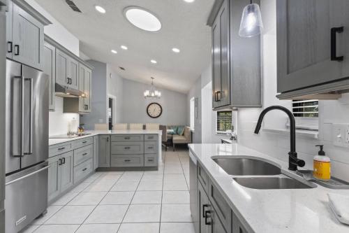 a kitchen with a sink and a counter top at Collinson Ct Retreat | Palm Coast in Palm Coast