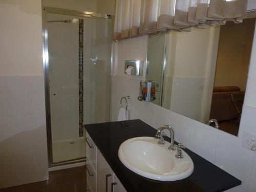 a bathroom with a sink and a shower at Dromana Beach Getaway in Dromana