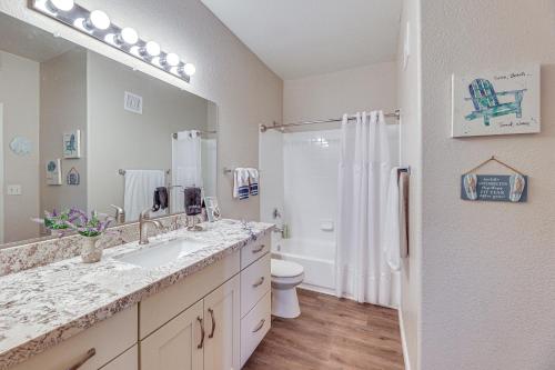 a bathroom with a sink and a toilet and a shower at First-Floor Condo with Pool Access in Mesa! in Mesa