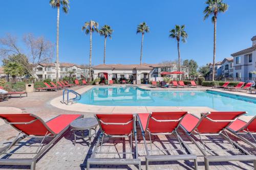 a swimming pool with chairs and a table and a table and chairs at First-Floor Condo with Pool Access in Mesa! in Mesa