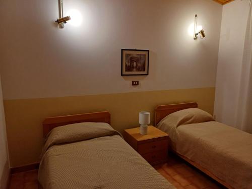 Postel nebo postele na pokoji v ubytování Albergo Dalla Mena