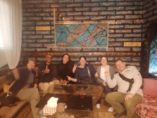 a group of people sitting in a room at Petra Musa Rural House in Wadi Musa