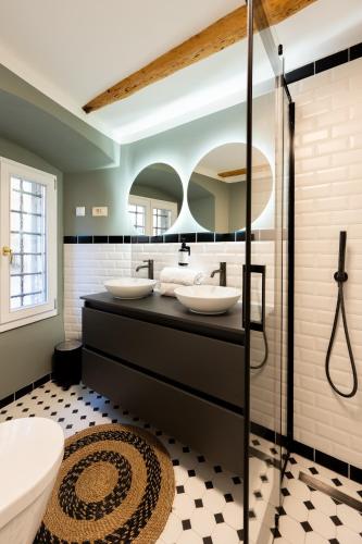 a bathroom with two sinks and a shower at Eselböck Villa Valter - Historic seaside House in Lovran in Lovran