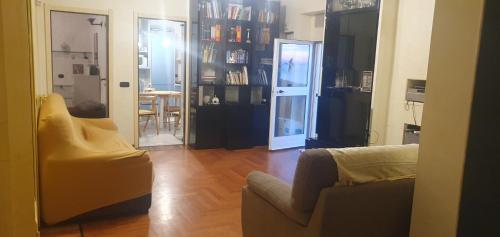 a living room with a couch and a chair at SESTRI Villa Vignolo with POOL in Sestri Levante